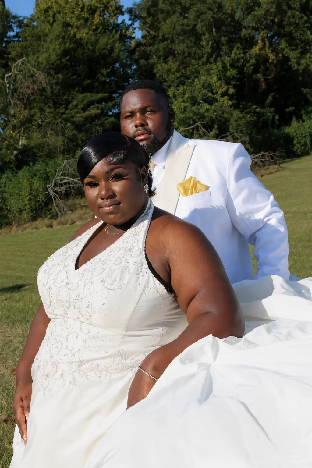 Bride and groom in the grass