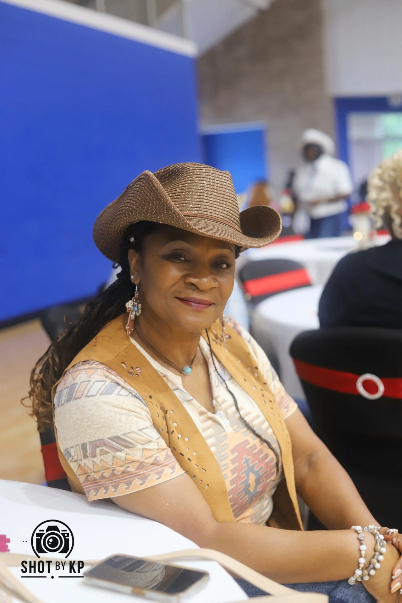 Elder portrait in cowboy hat and southwestern vest