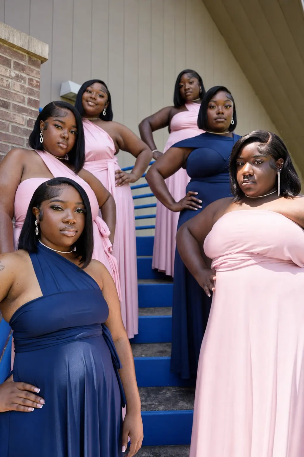 Bridesmaids on blue stairs