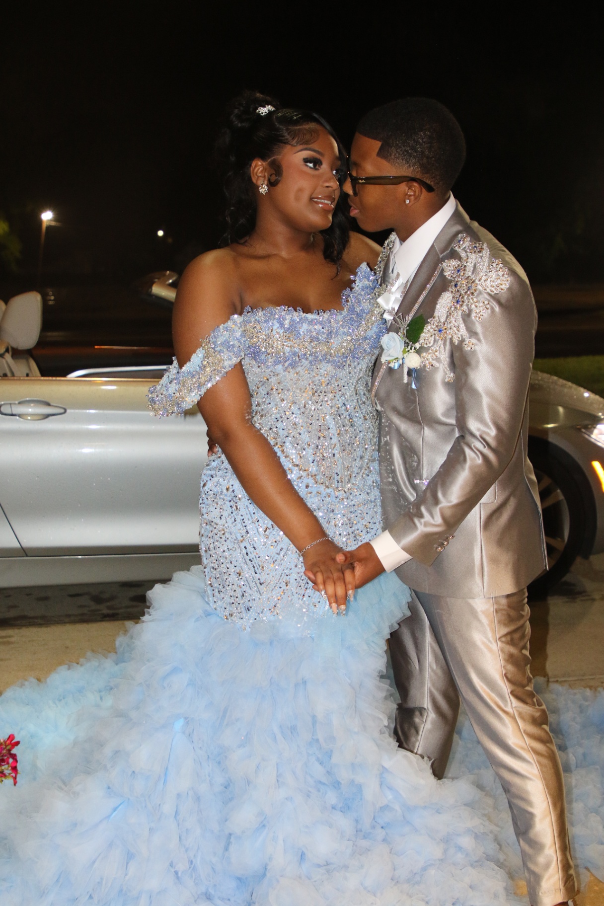 Prom couple in silver suit and powder blue gown