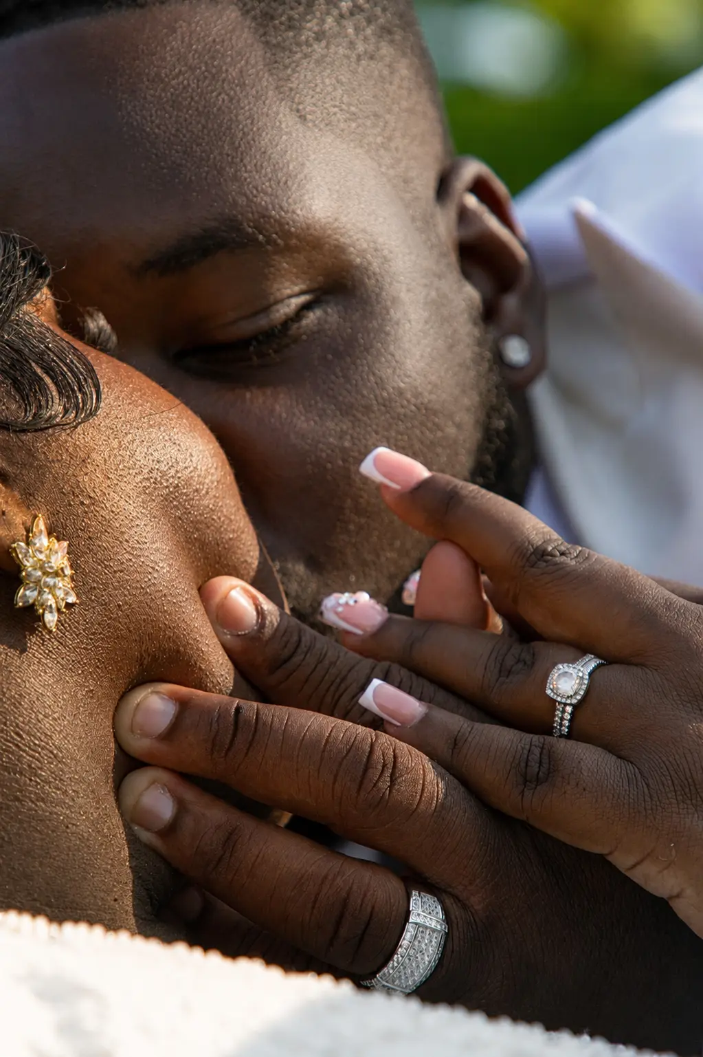 Close-up kiss with rings