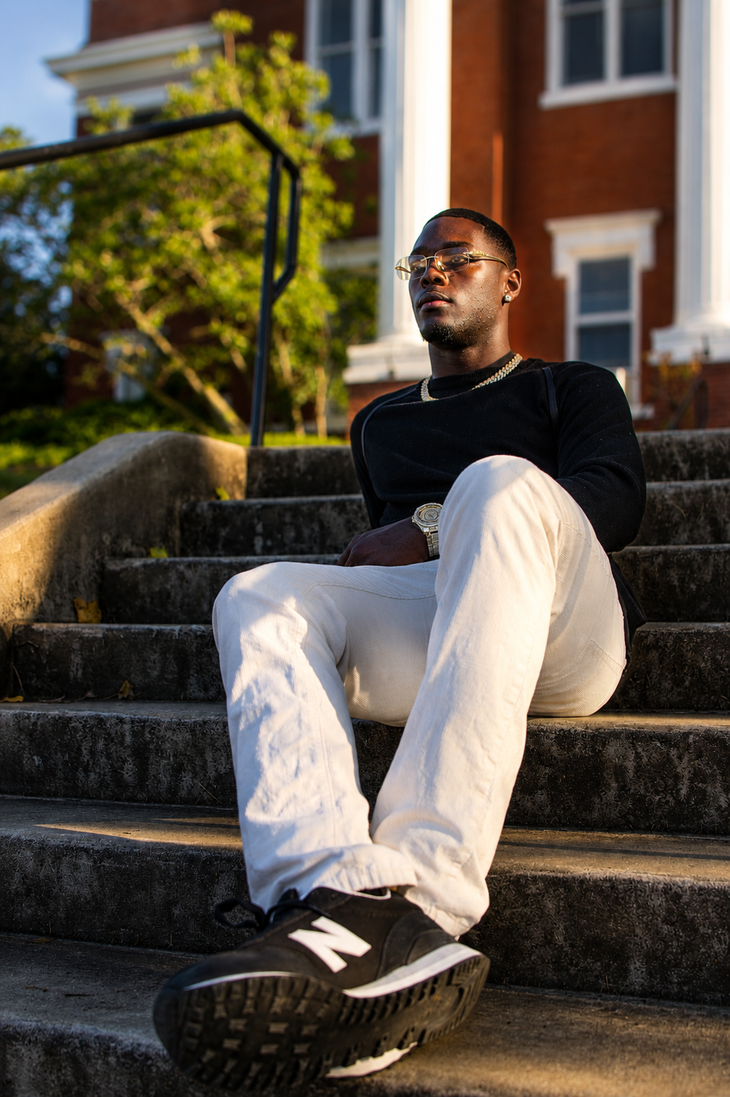 Man on concrete stairs golden hour